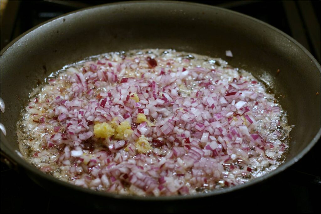 Add Red Onions and Garlic to Bacon Fat