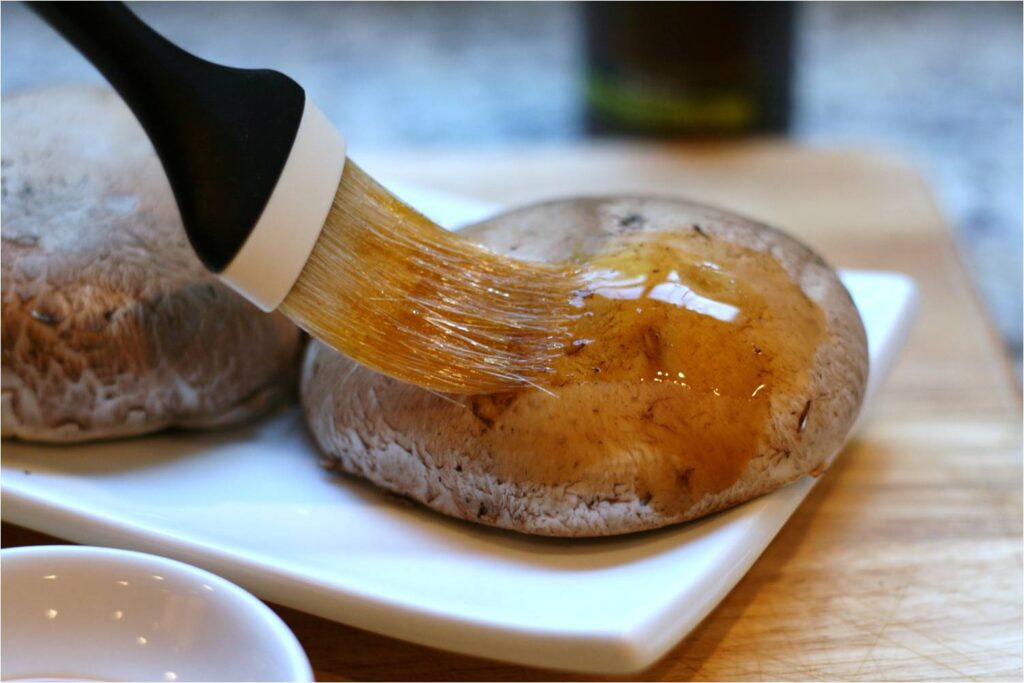 Brush Harissa Onto Portobello Caps