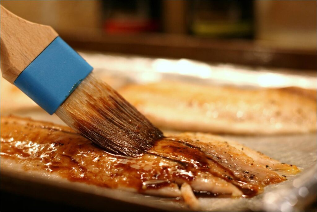 Brush Pomegranate Glaze onto Tilapia