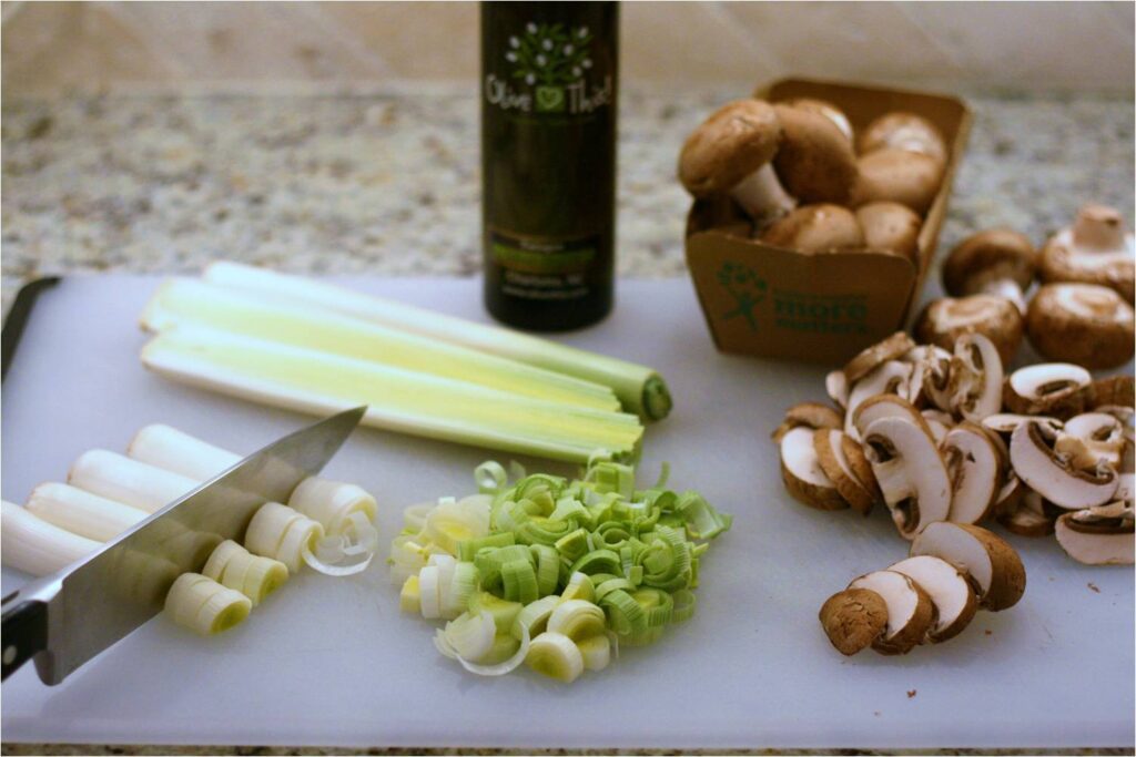 Chop leek and cremini mushrooms