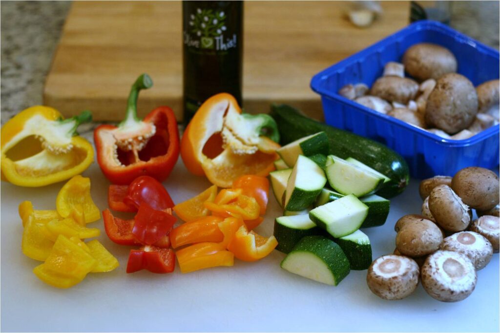 Chop vegetables for lamb kebabs