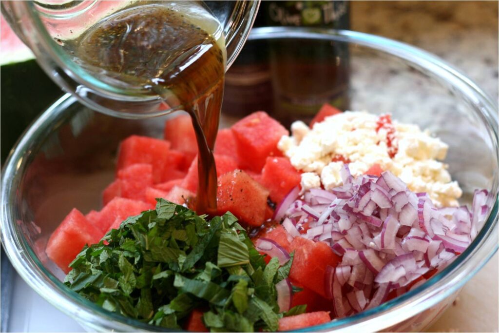 Combine watermelon salad ingredients and drizzle dressing