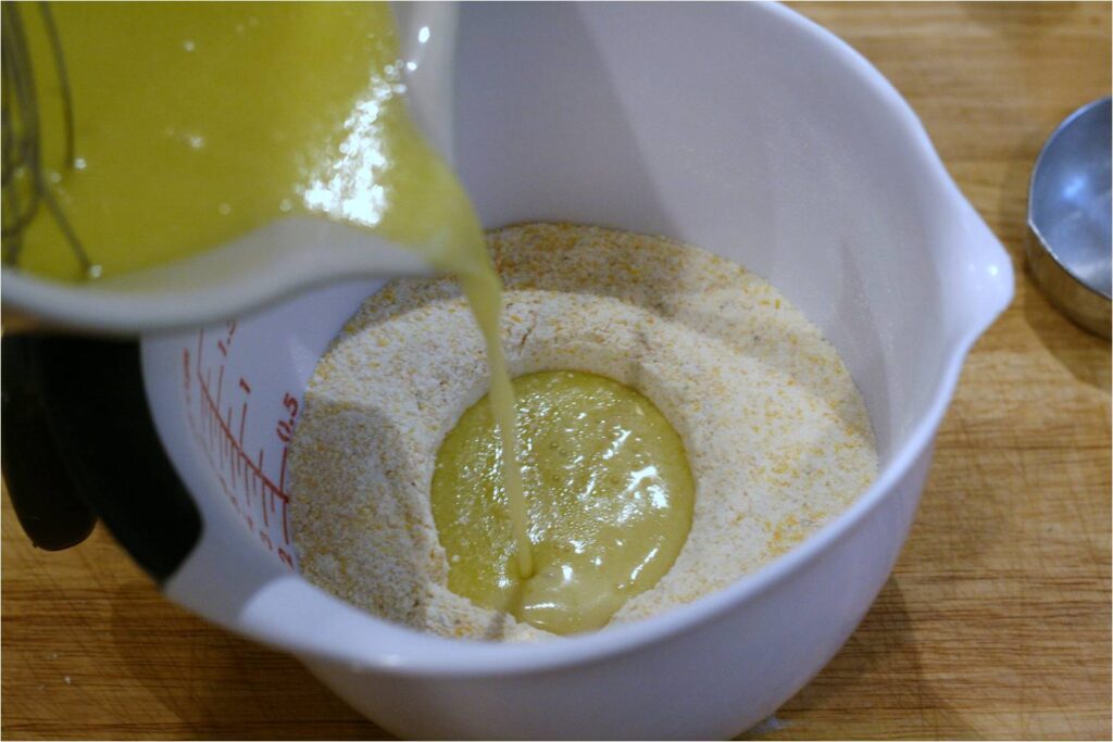 Combine wet and dry ingreds for Lemon Honey Muffins