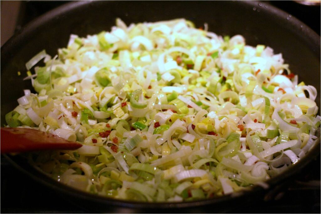 Cook the chopped leeks with pancetta