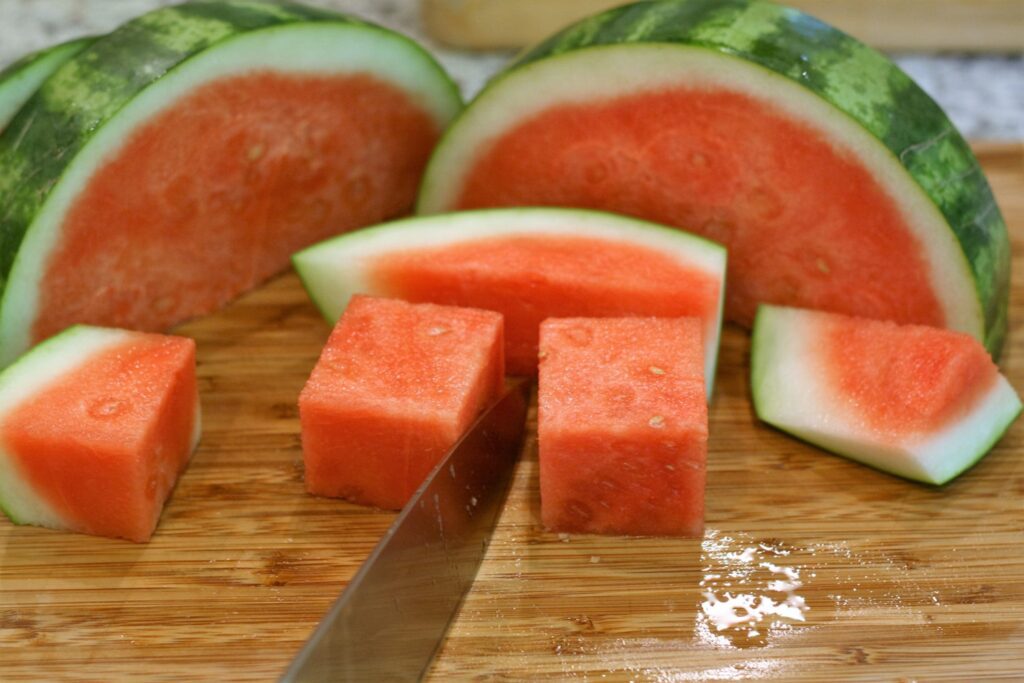 Cut watermelon into cubes