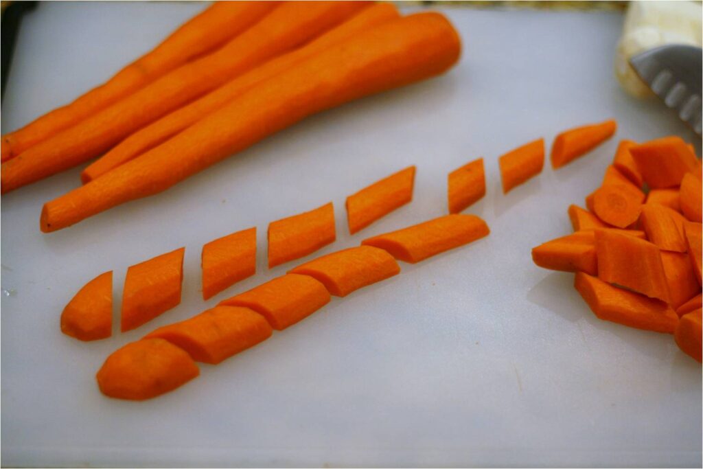 Dice carrots and parsnips