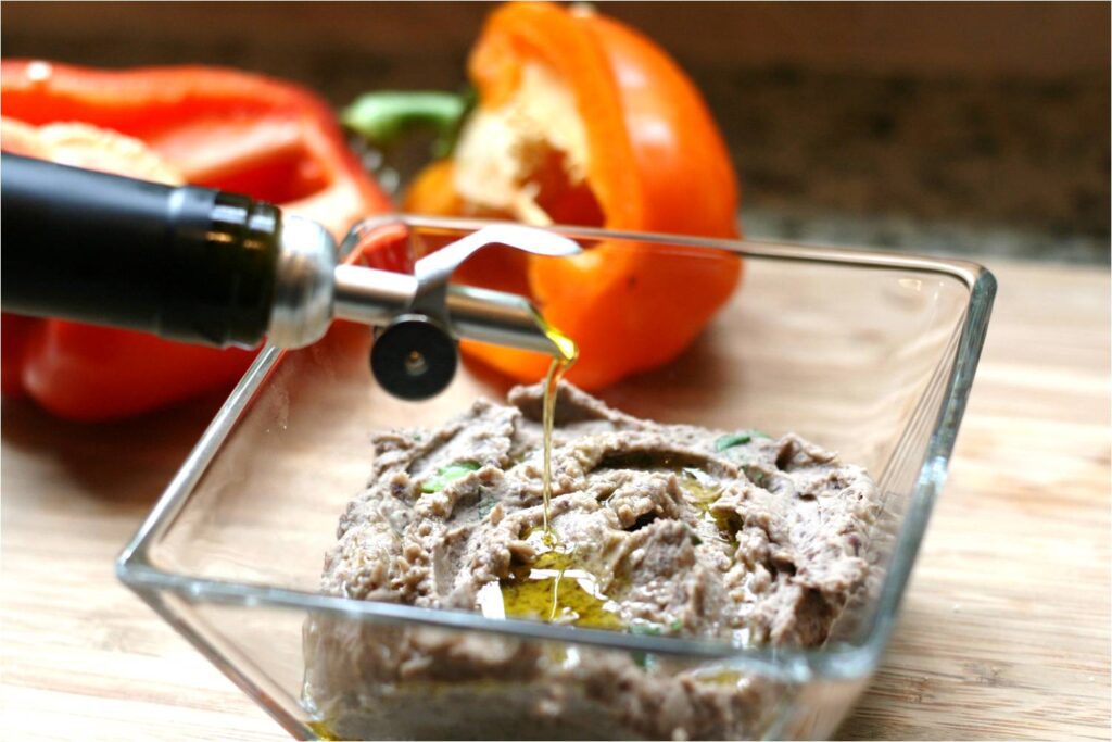 Drizzle Garlic EVOO over Black Bean Hummus