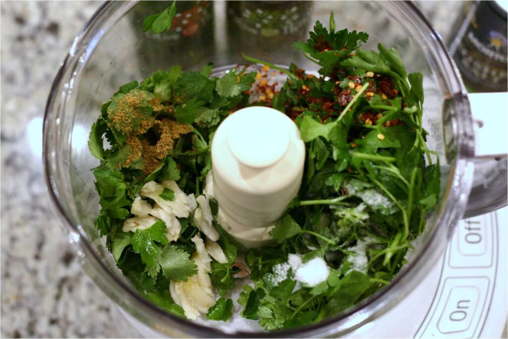 Load food processor with Chimichurri ingredients