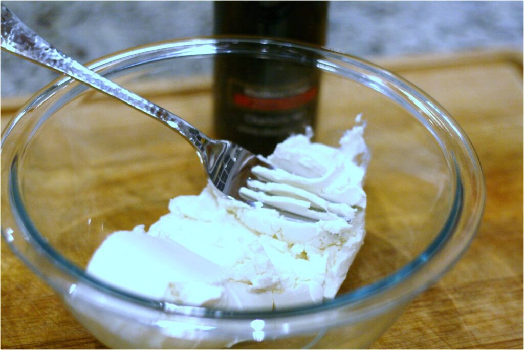 Mash goat cheese for blackberry ginger srpead