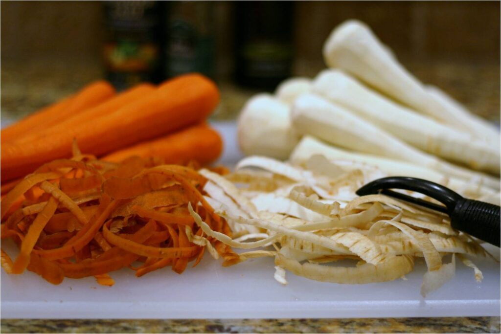 Peel carrots and parsnips