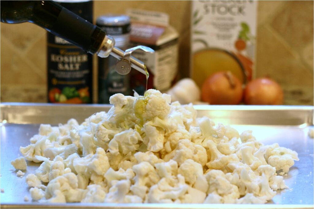 Pour EVOO on Cauliflower for Soup with Fennel EVOO