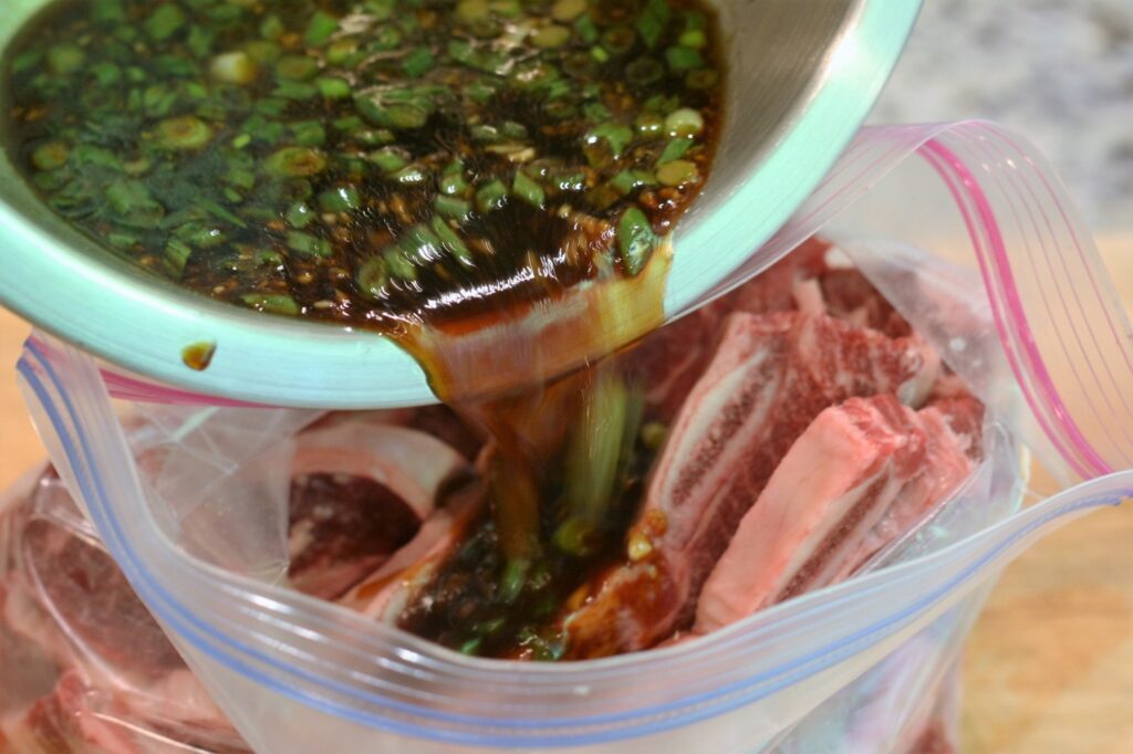 Pour Khal Bi marinade over short ribs