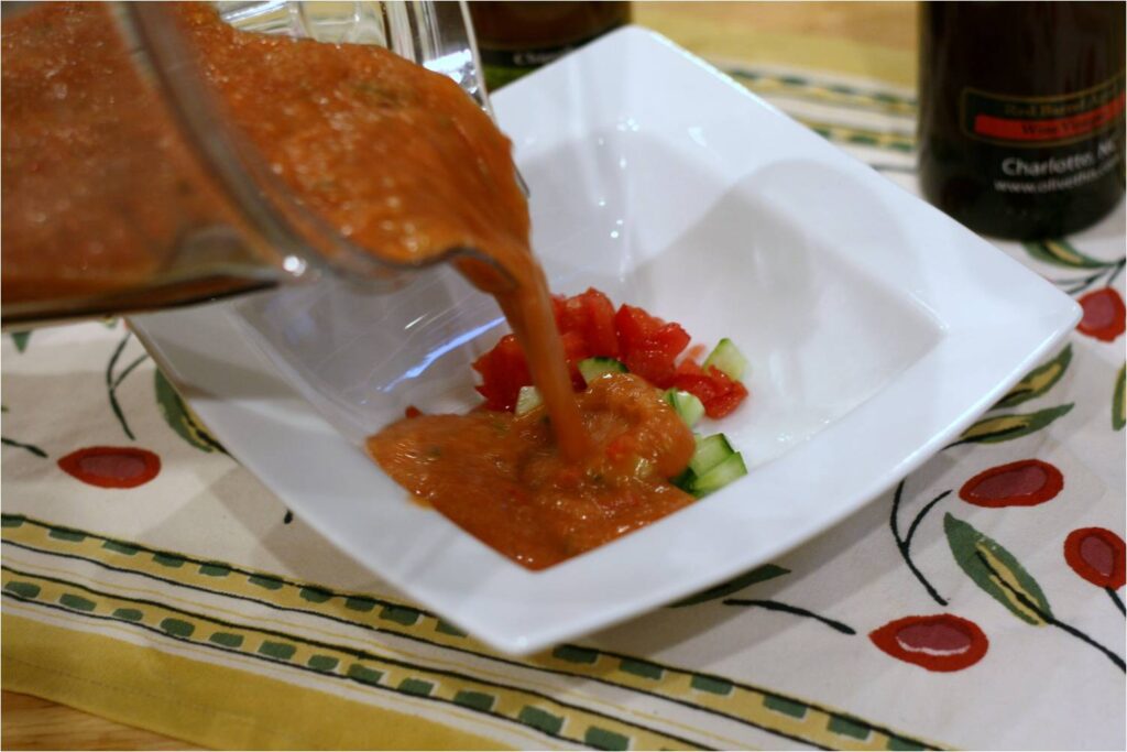 Pour gazpacho onto veggies