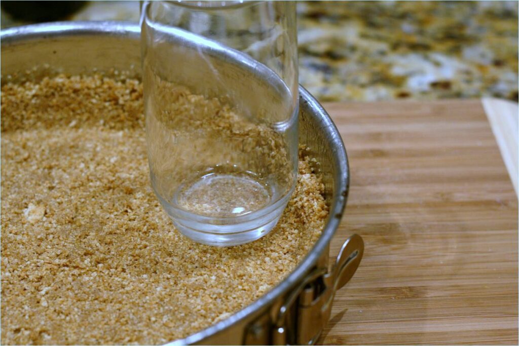 Press Graham Cracker Crust into Pan