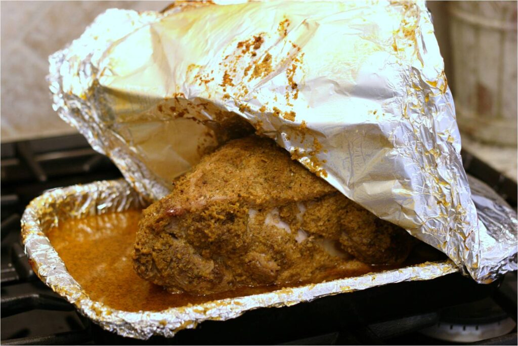 Remove Foil from slow roasted pork