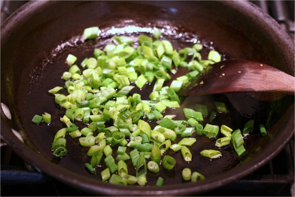 Saute Chopped Scallions in EVOO