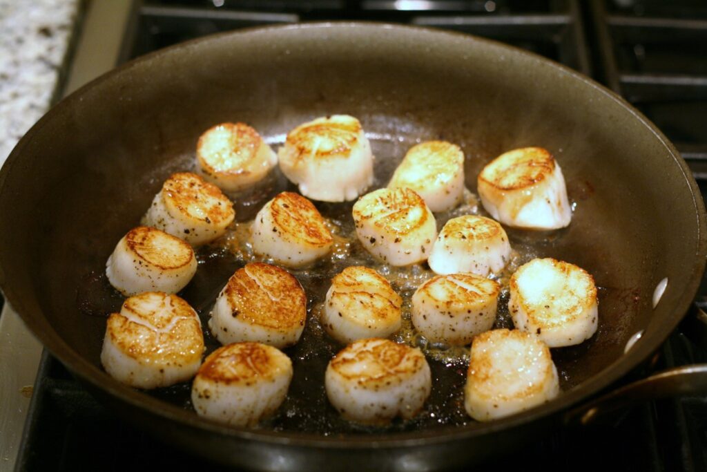 Searing the scallops in the skillet