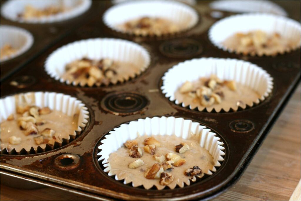 Top Banana Muffin Batter with Walnuts